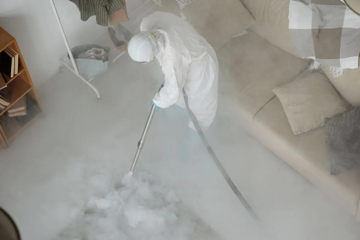 Biohazard cleanup technician in protective equipment, Caro, MI